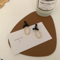 [925銀針]韓國黑色蝴蝶結珍珠耳環 - 软垫耳夹款