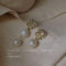 [925銀針]珍珠不對稱設計耳環 - A547